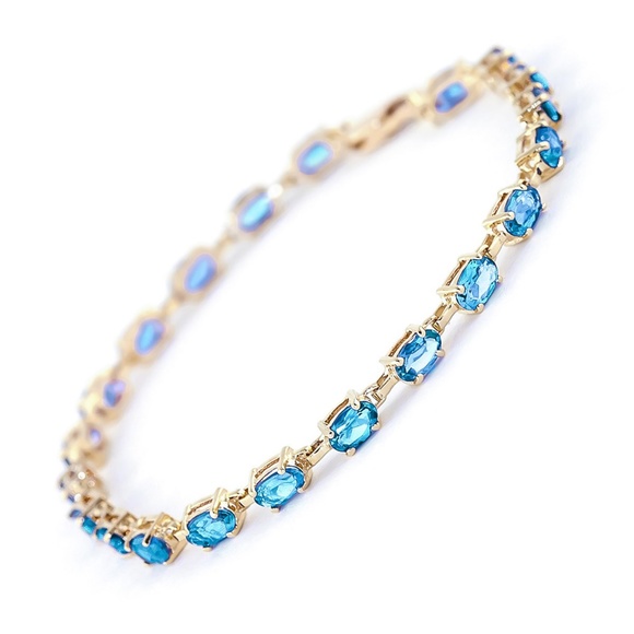 14K. SOLID GOLD TENNIS BRACELET WITH BLUE TOPAZ (Yellow gold) - Picture 1 of 4